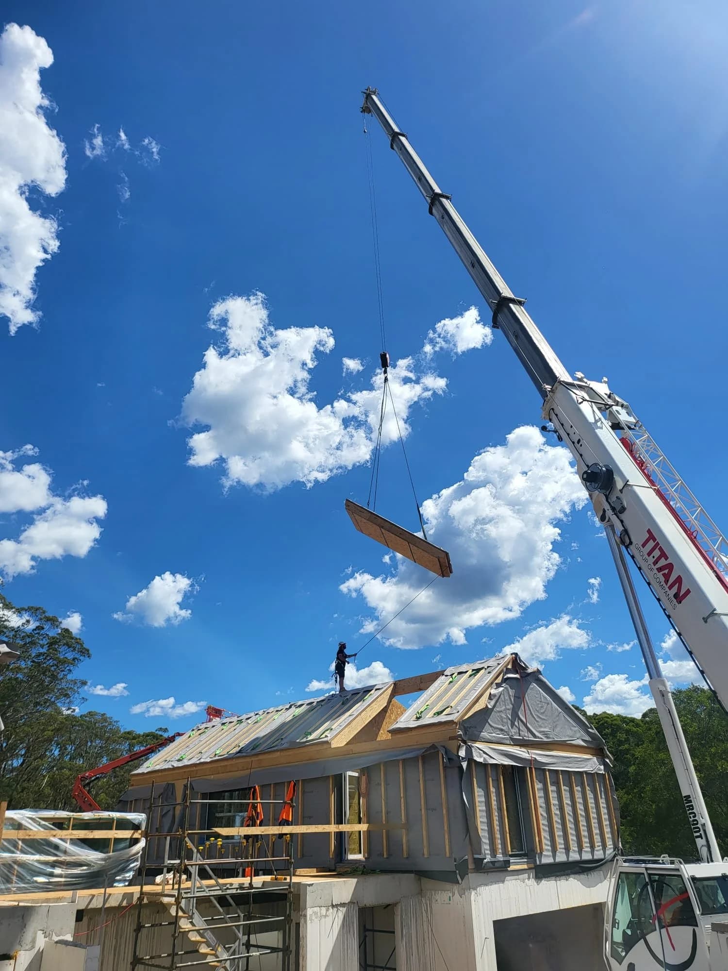 A prefabricated pod being craned into place during construction